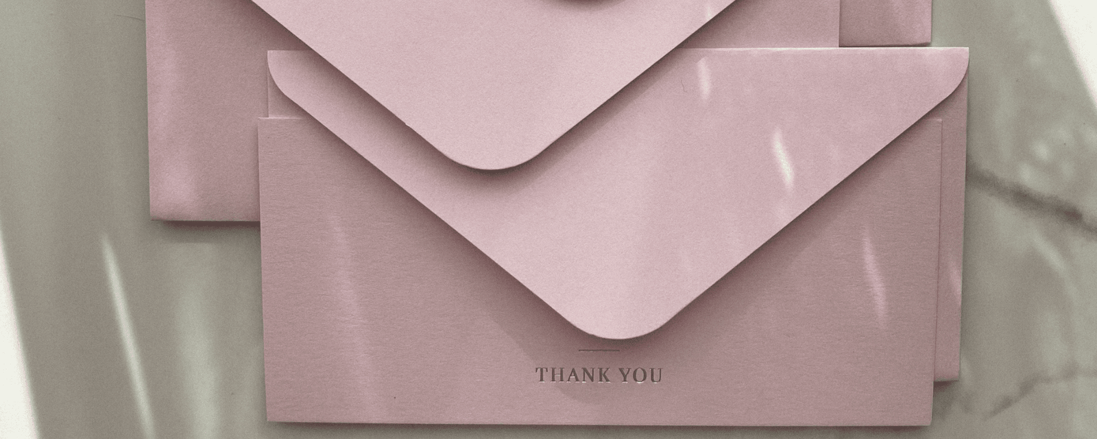 Foil-stamped invitation and business card with metallic highlights