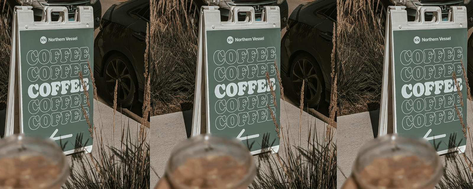 A sidewalk sandwich board sign outside a local storefront